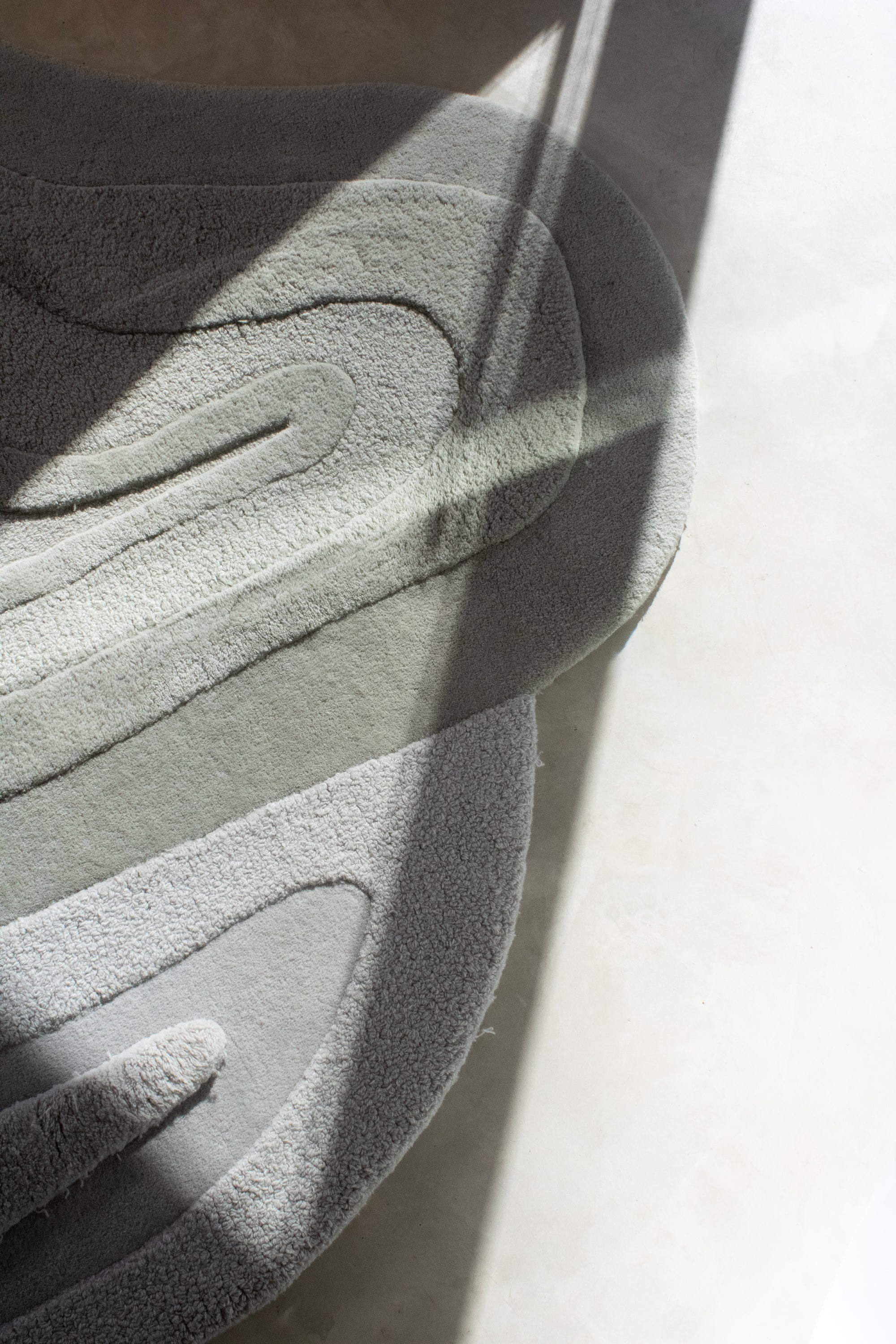 ALBA wool rug surface detail showing layered pink contours and varying pile heights