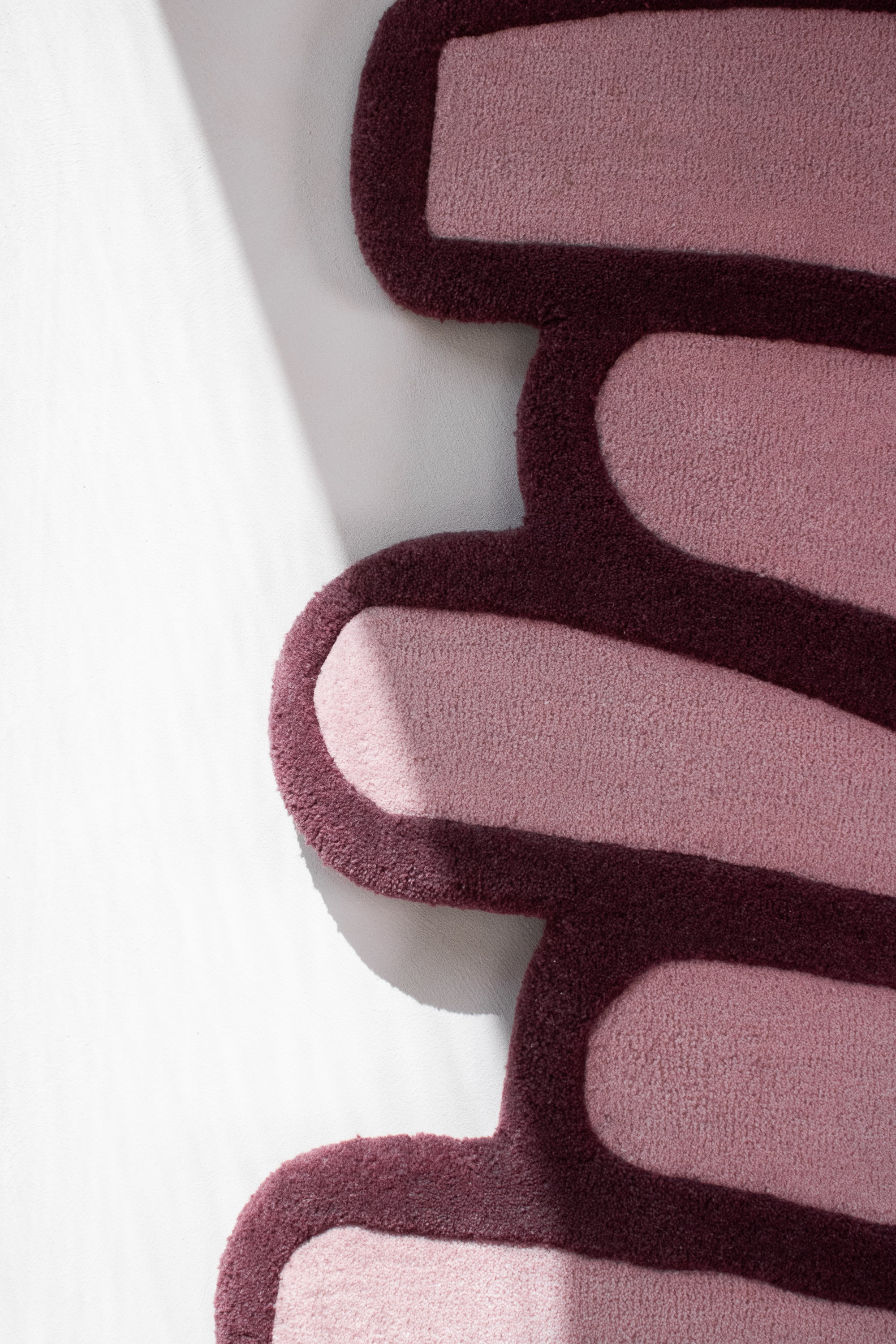 LAYERED wool rug vertical detail showing flowing stacked shapes